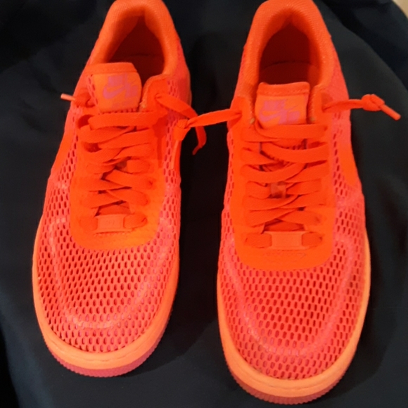 fluorescent orange nike shoes